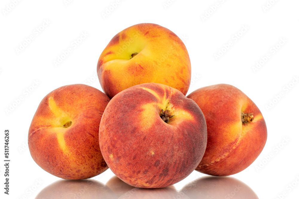 Four sweet organic peaches, close-up, isolated on white background. Four sweet organic peaches, close-up, isolated on white background.