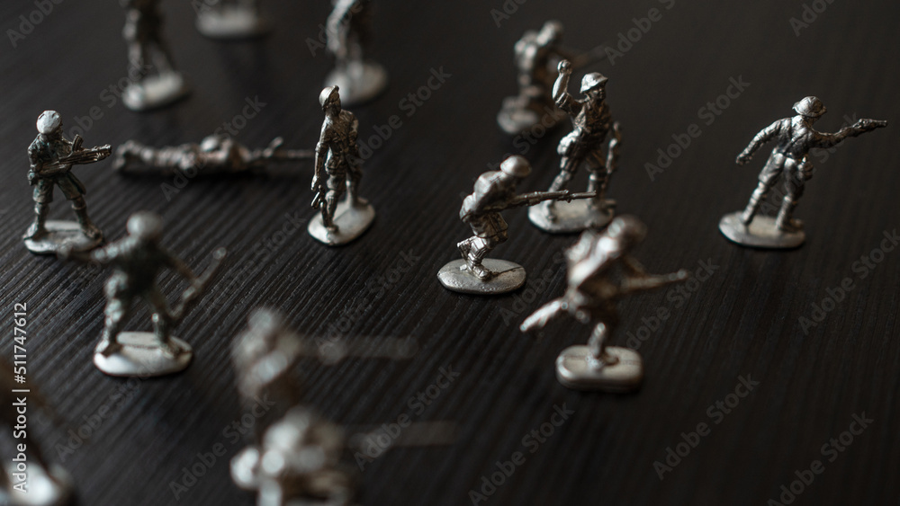 The concept of war and confrontation, political crises, toy tin soldiers attacking each other The concept of war and confrontation, political crises, toy tin soldiers attacking each other