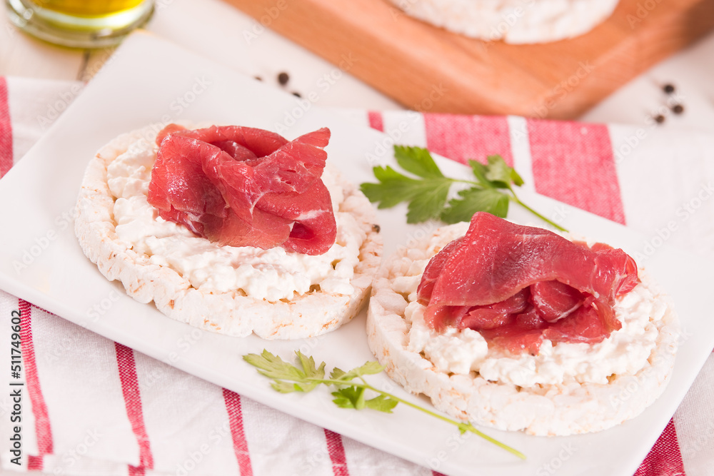 Rice cakes with milk flakes and cold beef. Rice cakes with milk flakes and cold beef.