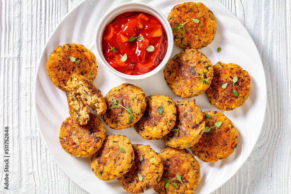 cauliflower patties on plate with tomato sauce cauliflower patties on plate with tomato sauce