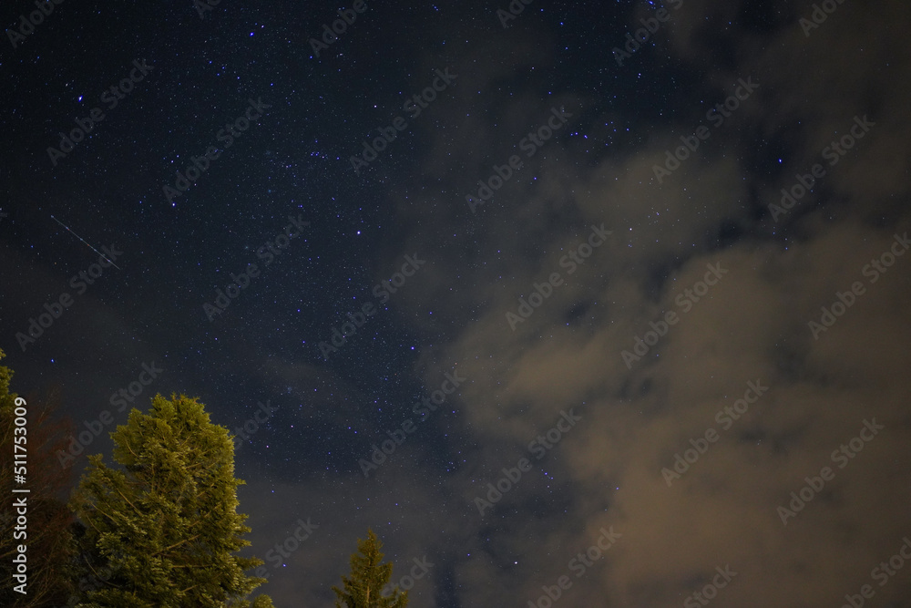 Distant Snowy winter mountain stars in the night sky