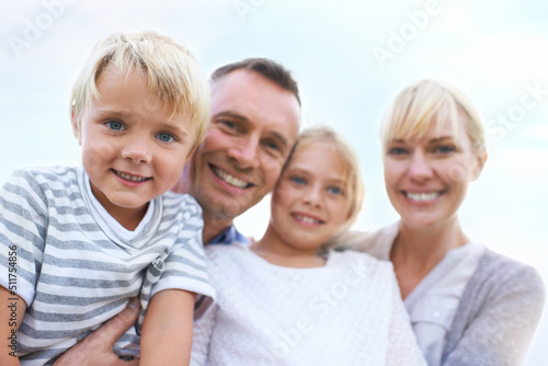 Theyre such a happy family. A happy two generation family smiling while outdoors.