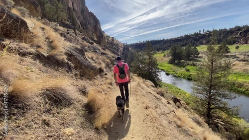 Male hiker with dog on trail in Smith Rock State Park photo