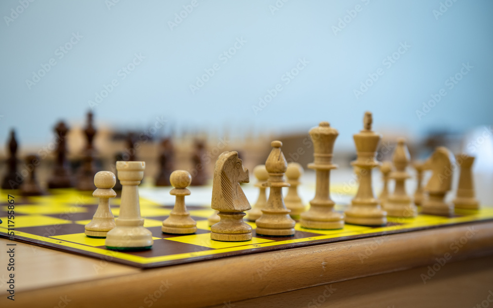 chess board, photo of chess and clock on the table, strategic chess game on wooden board chess board, photo of chess and clock on the table, strategic chess game on wooden board