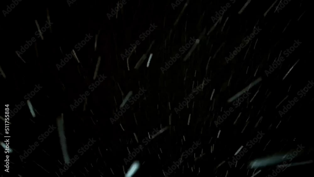 Night snowstorm. Blustery snowfall moving quickly towards the camera. Forward motion through a snow blizzard. Black background. Falling snowflakes, textured pattern. Footage. Winter season. Xmas. Night snowstorm. Blustery snowfall moving quickly towards the camera. Forward motion through a snow blizzard. Black background. Falling snowflakes, textured pattern. Footage. Winter season. Xmas.