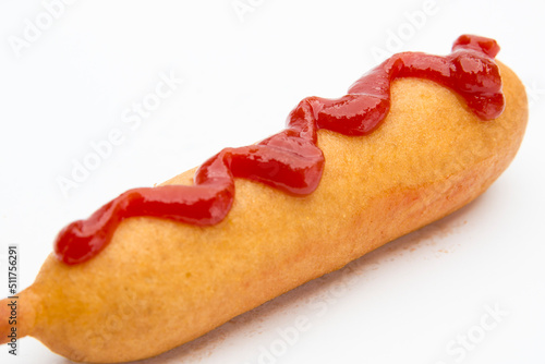 Corndog isolated on white with ketchup