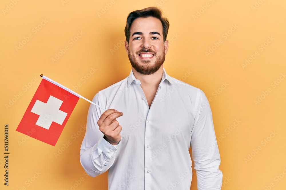 Wie Bekommt Man Selbstbräuner Von Den Händen Weg Handsome caucasian man with beard holding switzerland flag looking