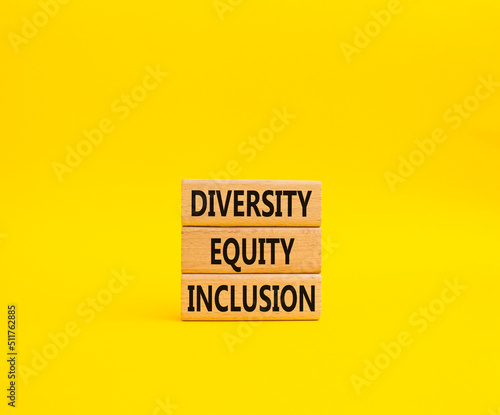 Diversity Equity Inclusion symbol. Concept words Diversity Equity Inclusion on wooden blocks. Beautiful yellow background. Business and Diversity Equity Inclusion concept. Copy space