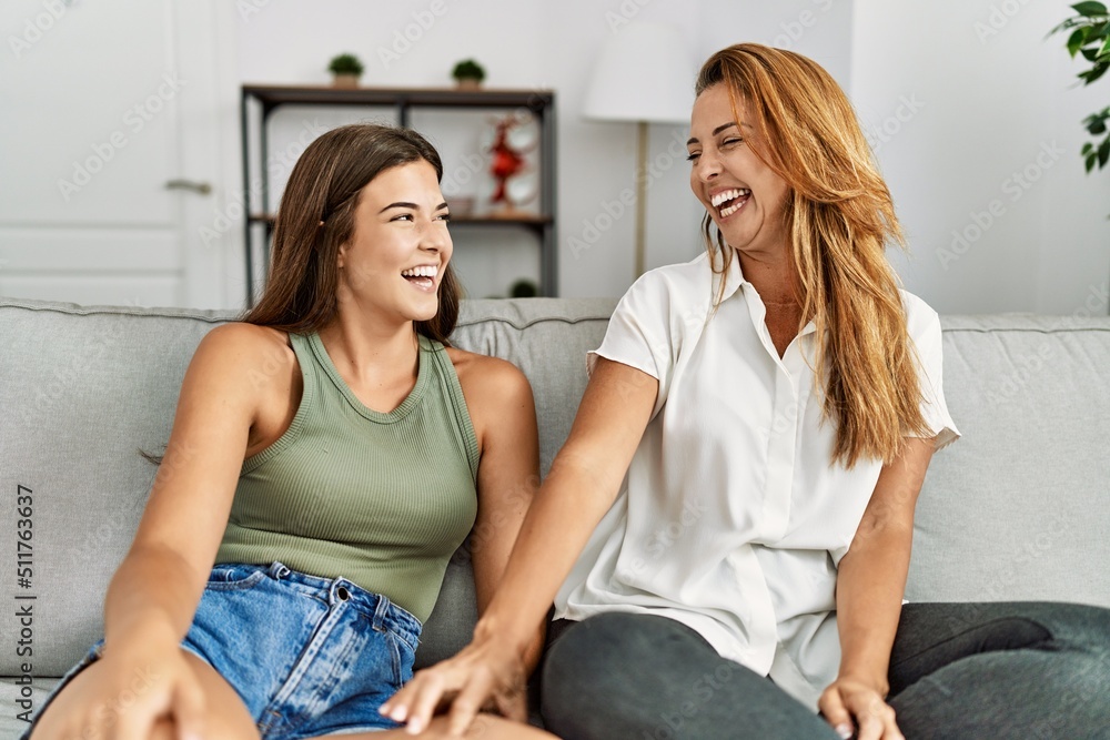 Mother and daughter smiling confident sitting on sofa at home Mother and daughter smiling confident sitting on sofa at home