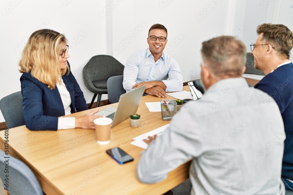 Group of middle age business workers working at the office. Group of middle age business workers working at the office.