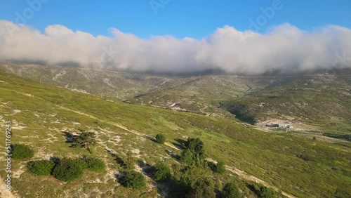 The journey to the summit over mountains, clouds, green grass, overcoming difficulties, being strong, you will definitely succeed, never give up