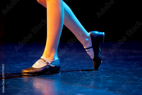 Image of tap shoes being used on a stage.
