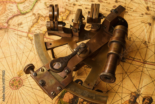 Obraz na plátně Vintage sextant on old map. Old style background.