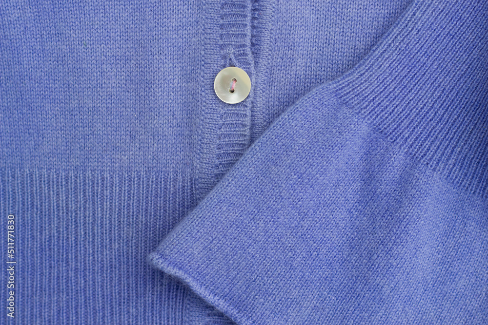 close up of blue casmere warm sweater with button close up of blue casmere warm sweater with button