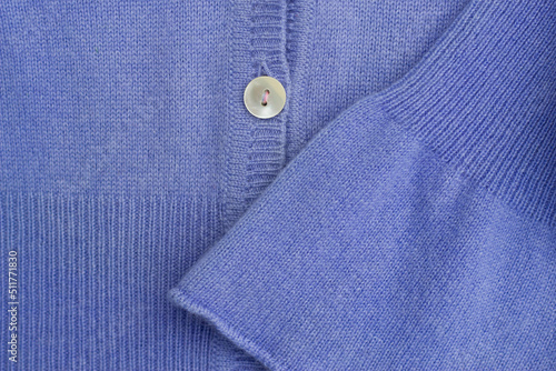 close up of blue casmere warm sweater with button