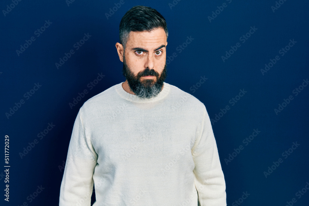 Young hispanic man wearing casual clothes skeptic and nervous, frowning upset because of problem. negative person. Young hispanic man wearing casual clothes skeptic and nervous, frowning upset because of problem. negative person.