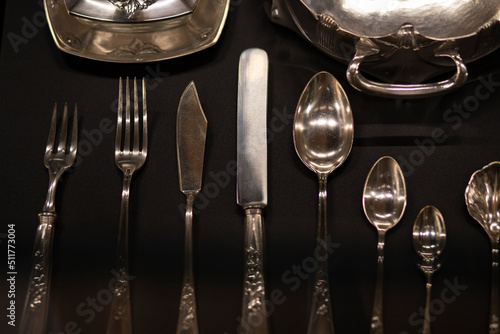 antique silverware on a wooden table