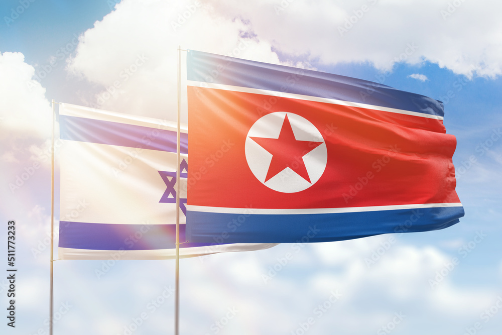 Sunny blue sky and flags of north korea and israel Sunny blue sky and flags of north korea and israel