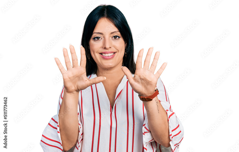 Young hispanic girl wearing casual clothes showing and pointing up with fingers number ten while smiling confident and happy. Young hispanic girl wearing casual clothes showing and pointing up with fingers number ten while smiling confident and happy.