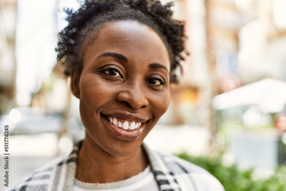 Young african american girl smiling happy standing at the city. Young african american girl smiling happy standing at the city.
