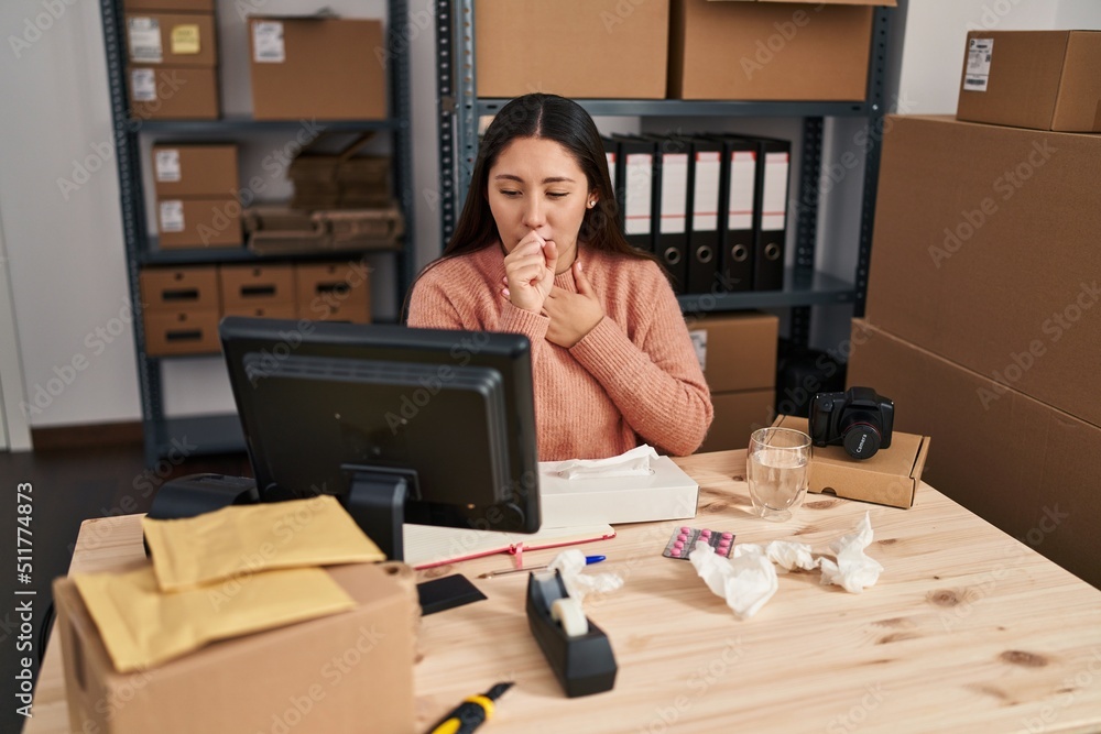 Young hispanic woman ecommerce business worker illness coughing at office Young hispanic woman ecommerce business worker illness coughing at office