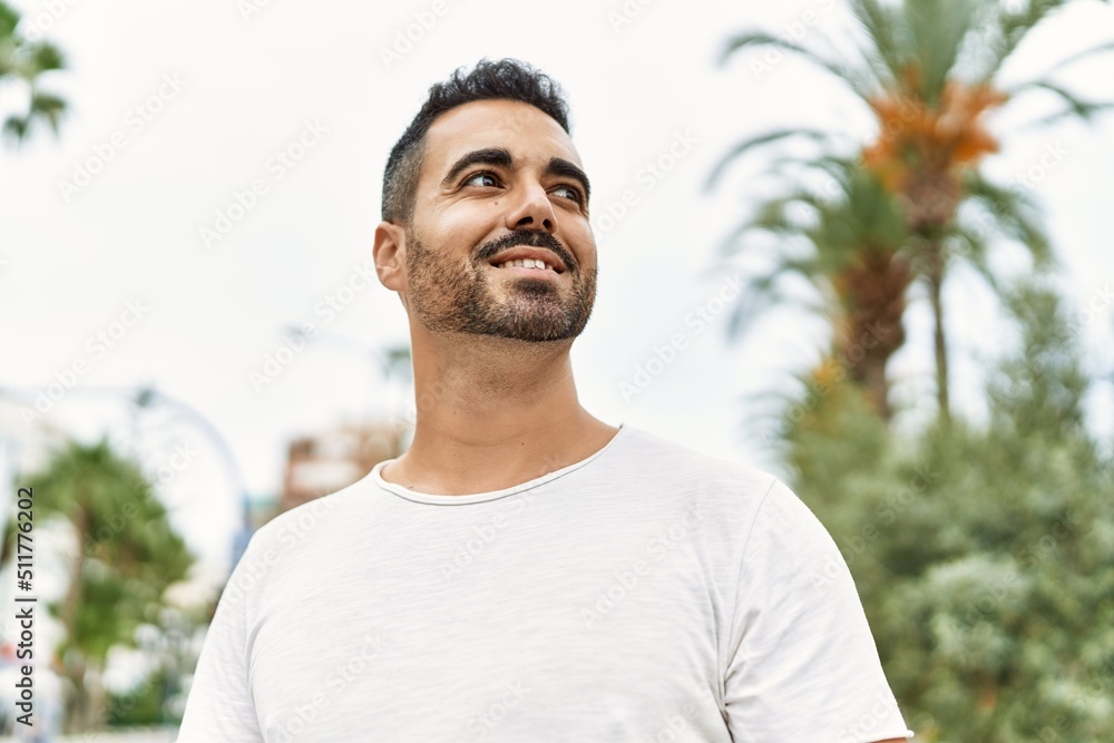 Young hispanic man smiling confident walking at street Young hispanic man smiling confident walking at street