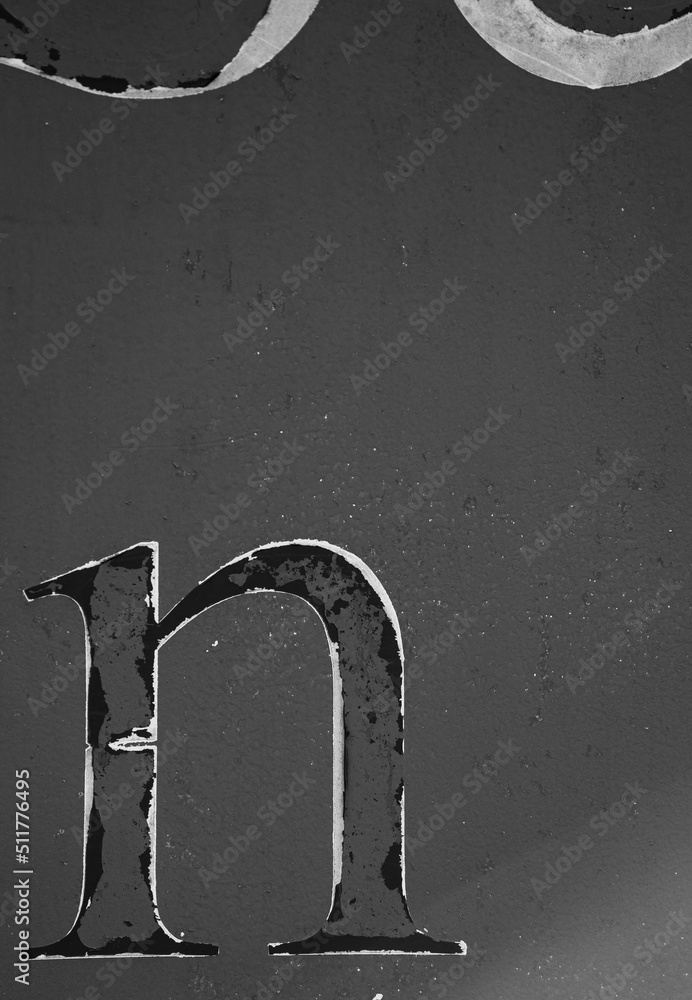 black-and-white-photo-of-the-letter-small-n-isolated-on-side-of-rusty