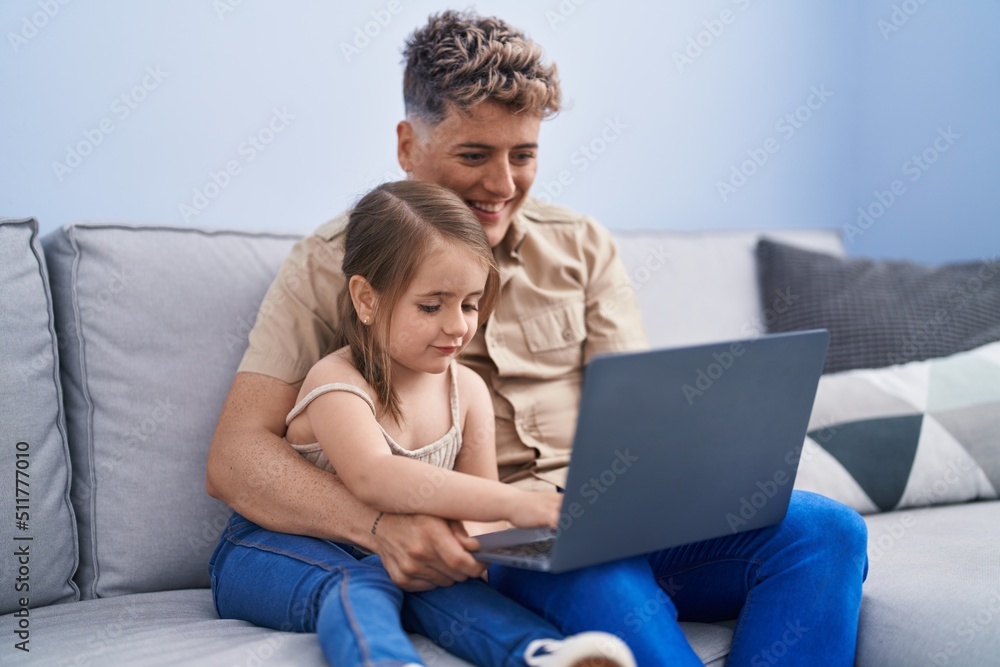 Father and daughter father and daughter using laptop at home Father and daughter father and daughter using laptop at home