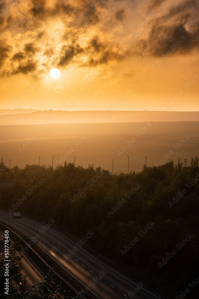 Fototapeta premium Sunset over empty motorway by Brighton, UK