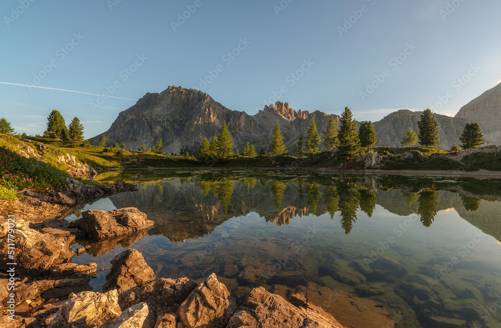 Lake Limedes in the first morning light. Beautiful reflections in the alpine lake.