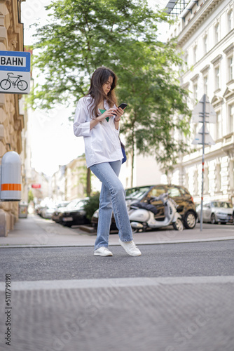 Freelance girl on the street with a phone leads her social life.