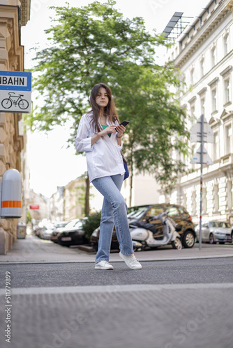Freelance girl on the street with a phone leads her social life.
