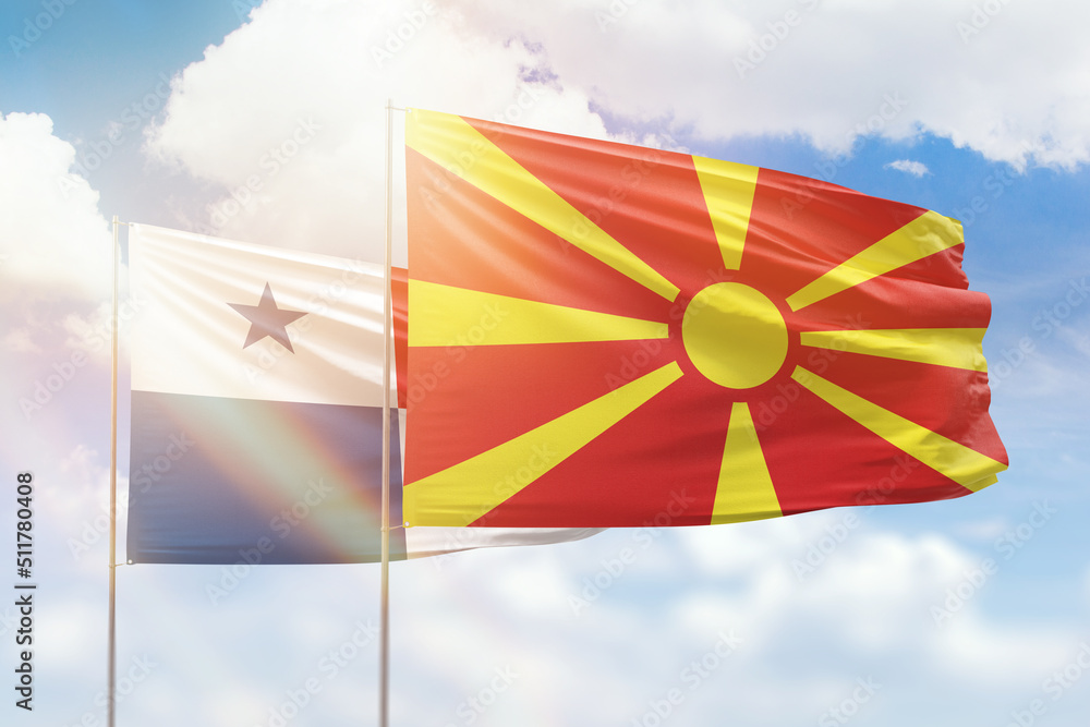 Sunny blue sky and flags of north macedonia and panama