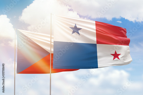 Sunny blue sky and flags of panama and czechia