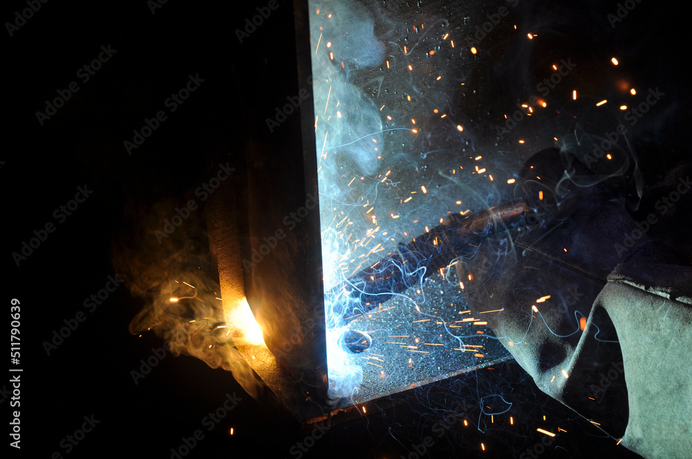 Weld Exploding Welding arc. The process of welding products and metal. Sparks fly ...