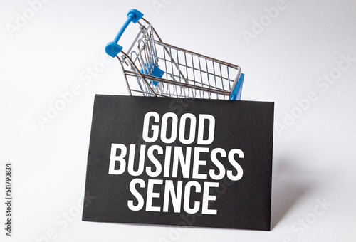 shopping card with black plate with text good business sense