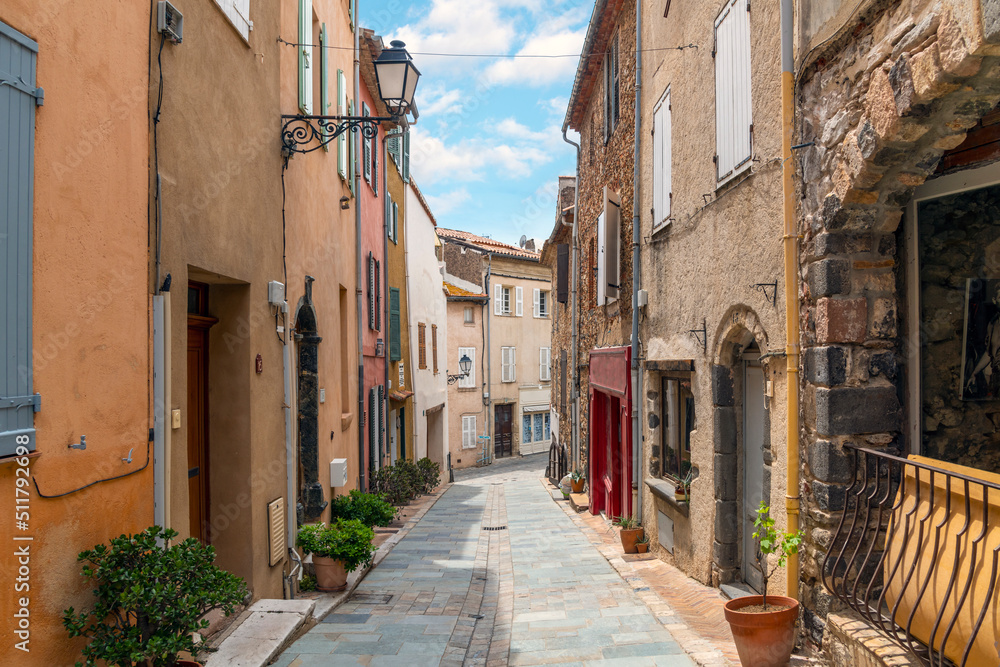 A charming, picturesque street in the medieval village of Grimaud, France, in the hills above Saint-Tropez along the French Riviera.
