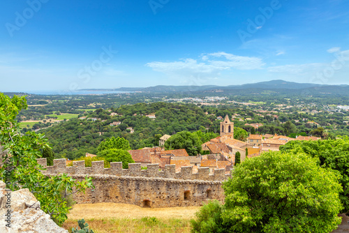 View of the medieval village of Grimaud France from the Chateau de Grimaud with the countryside of the Provence region of France and the Mediterranean Sea in view above Saint-Tropez, France.