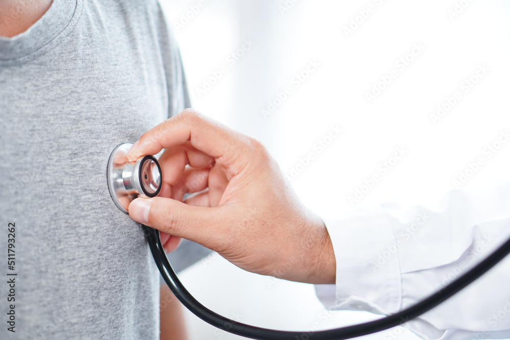 Fototapeta premium Asian doctor. Red heart. Portrait of a man. Doctor showing heart in hospital , doctor with stethoscope in hospital or clinic, doctor in lab coat in clinic