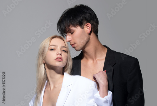 Young man and blonde woman. Sexy young couple in love. Young lovers hugging and embracing. Couple in love tenderness and affection.