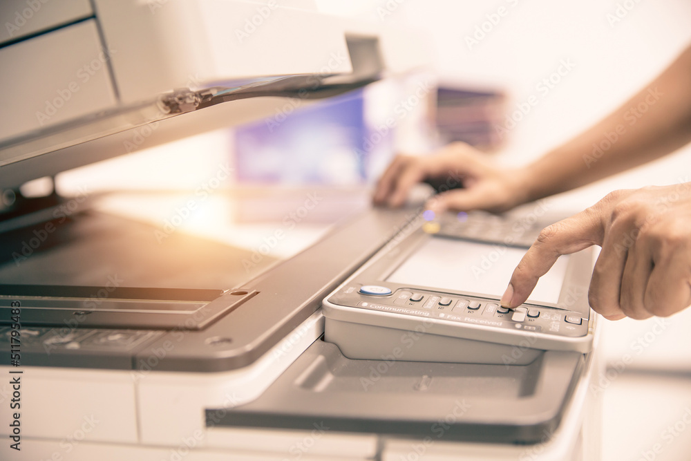 Photocopier printer, Close up hand office man press copy button on panel to using the copier or photocopy machine for scanning document or printing a sheet paper and xerox photocopy. Photocopier printer, Close up hand office man press copy button on panel to using the copier or photocopy machine for scanning document or printing a sheet paper and xerox photocopy.