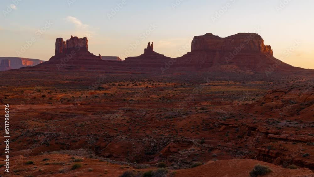 Time lapse of towering mesas at sunset in Monument Valley in Arizona, USA Time lapse of towering mesas at sunset in Monument Valley in Arizona, USA