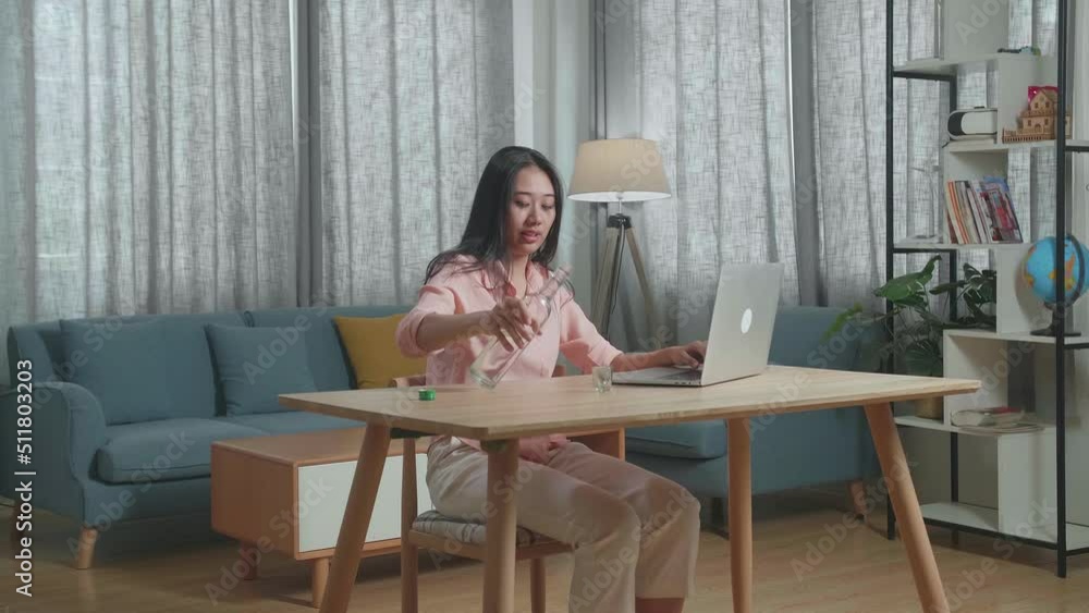 Drunk, Depressed Asian Woman Drinking Vodka From The Bottle At Home
Drunk, Depressed Asian Woman Drinking Vodka From The Bottle At Home