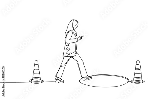 Single one line drawing Arabic businesswoman character going on street watching by smart phone, did not see open manhole. Woman walks to business trap. Continuous line draw design vector illustration
