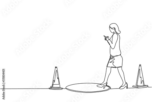 Single continuous line drawing businesswoman character going on street watching by smart phone, did not see open manhole. Woman walks to business trap. One line draw graphic design vector illustration