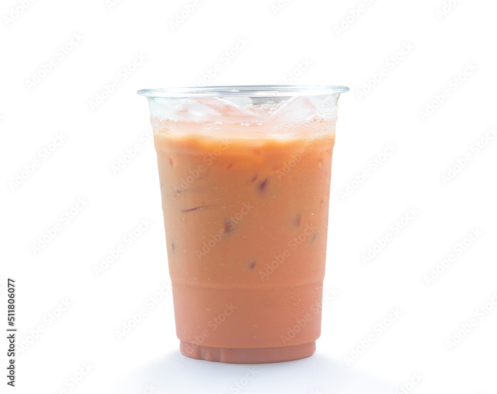 Orange Thai iced condensed milk tea in transparent plastic glass isolated on white background with clipping path Orange Thai iced condensed milk tea in transparent plastic glass isolated on white background with clipping path