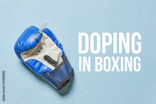 Blue boxing gloves close up. Concept - doping in sport on blue backgraund. Text-Doping in boxing