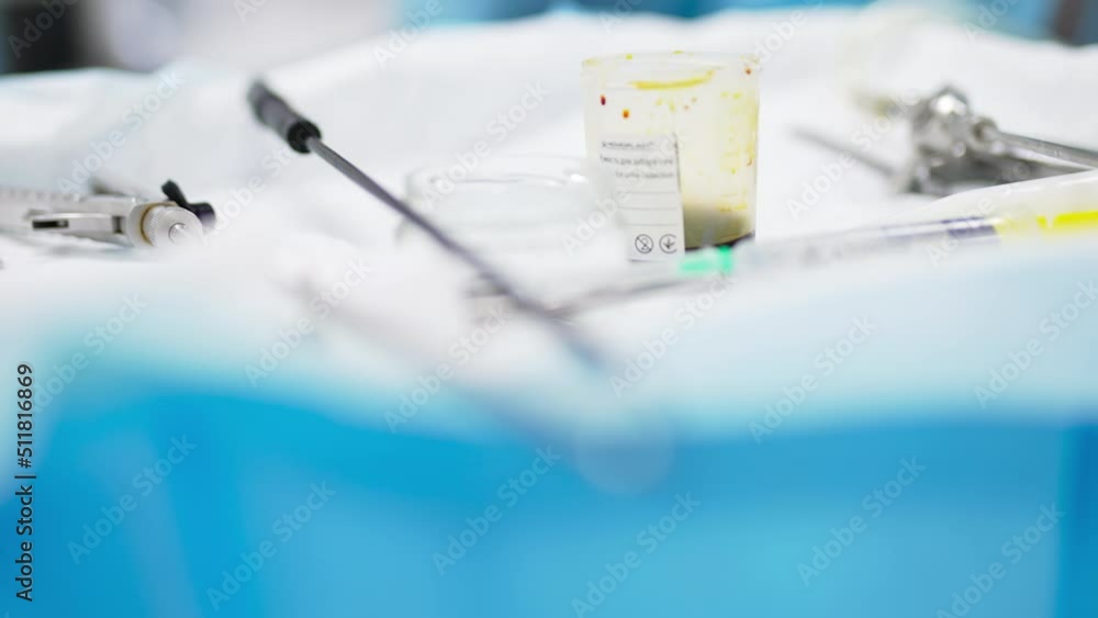 Instruments and tools prepared for surgery. Devices at the table close up. Blurred foreground transforms into blurred backdrop. Instruments and tools prepared for surgery. Devices at the table close up. Blurred foreground transforms into blurred backdrop.