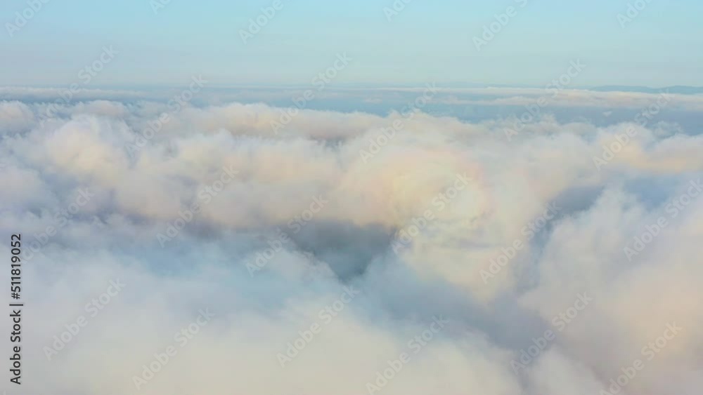 The drone rises from the thick fog over the beautiful ocean of clouds at dawn. The sun rises over an endless sea of clouds to the very horizon. Amazing natural landscape in 4k The drone rises from the thick fog over the beautiful ocean of clouds at dawn. The sun rises over an endless sea of clouds to the very horizon. Amazing natural landscape in 4k