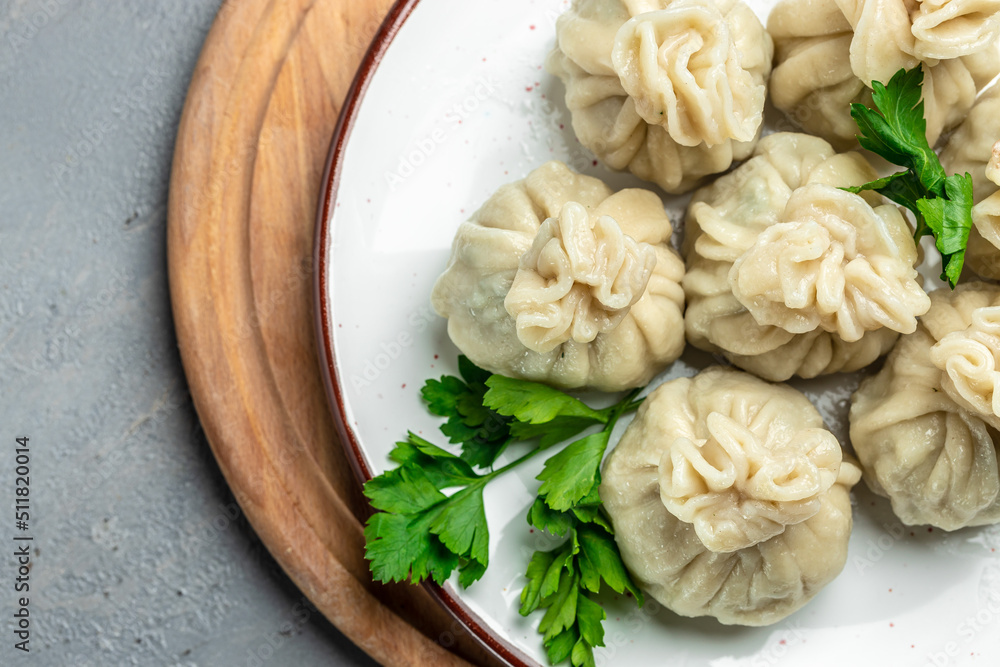 Georgian dumplings Khinkali with meat and spicy sauce. banner, menu, recipe place for text, top view